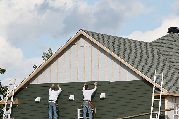 Professional Storm Damage Siding Repair technician working in La Center, WA